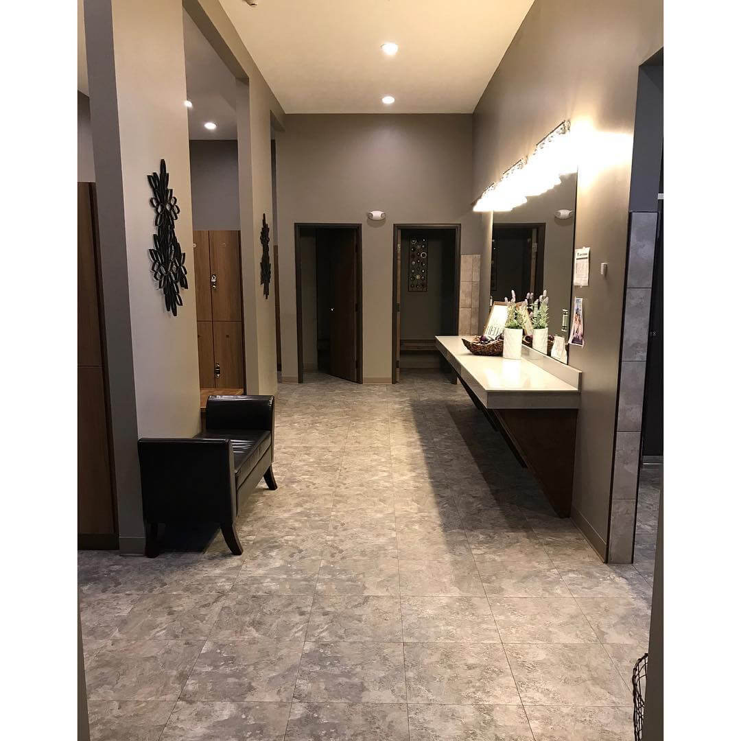 WOMENS LOCKER ROOM: Private showers & dress rooms